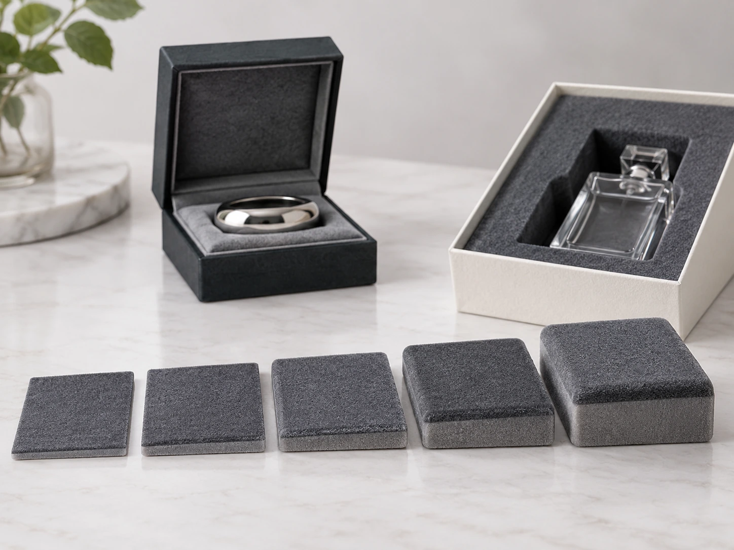 Progressive flocked sponge sample pads arranged from thin to thick, demonstrating how thickness influences cushioning and presentation. Progressive flocked sponge sample pads arranged from thin to thick, demonstrating how thickness influences cushioning and presentation.