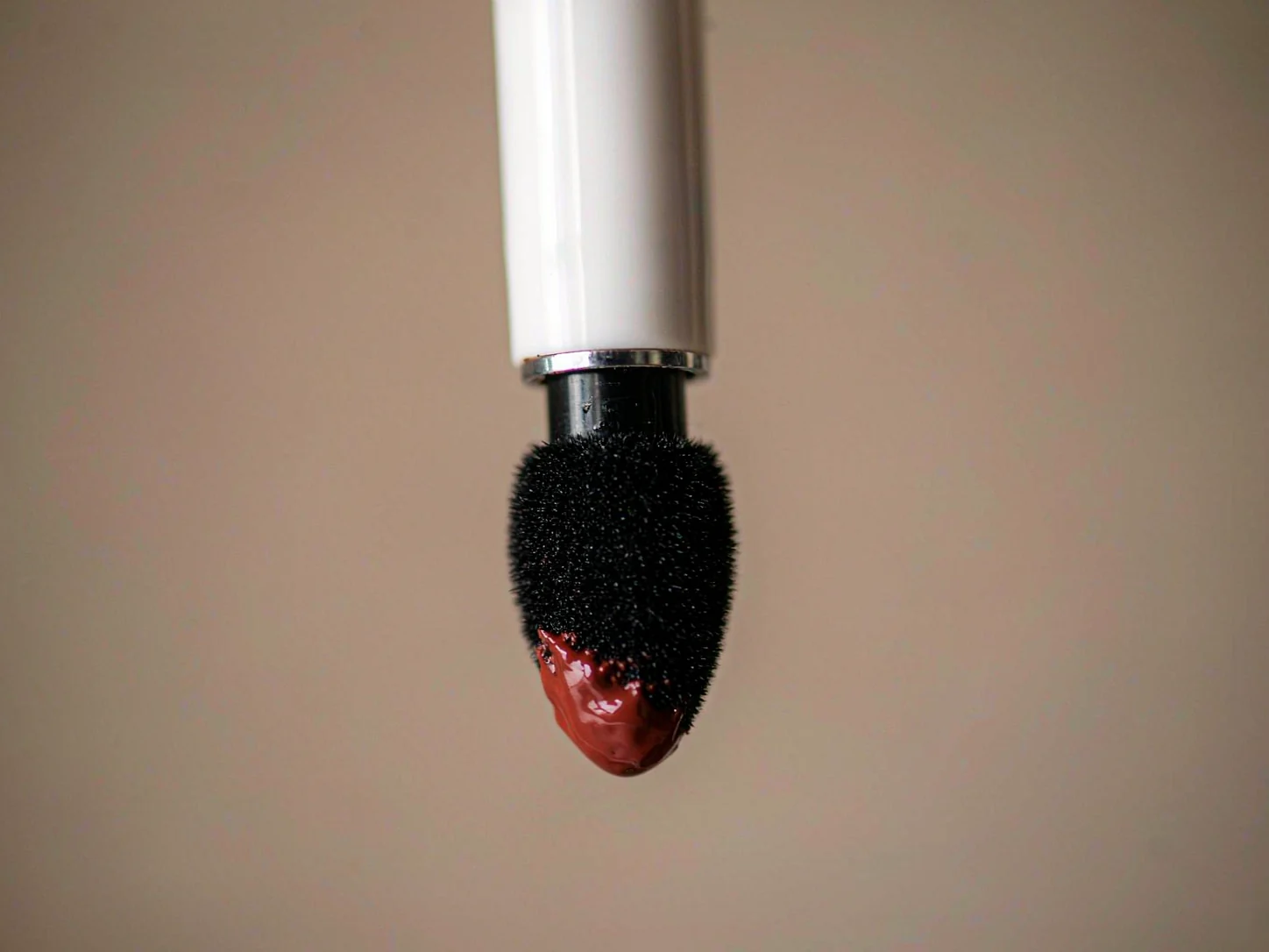 Liquid lipstick applicator with flocked precision tip