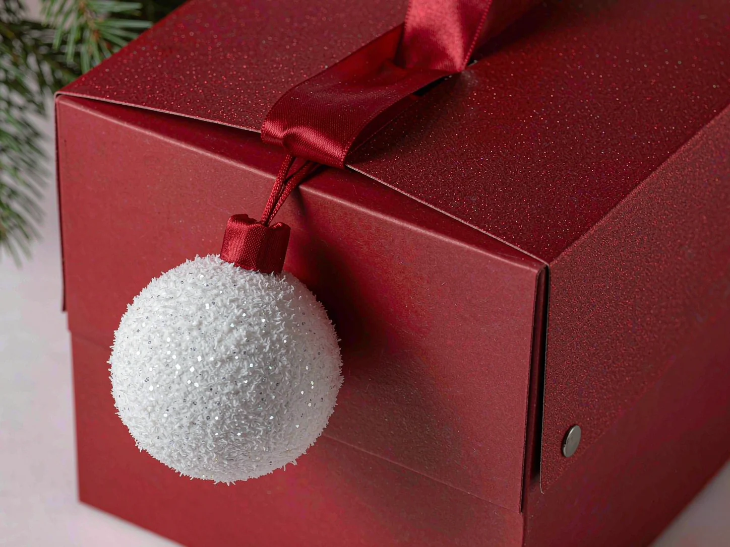 Flocked ornament accent on a Christmas gift box
