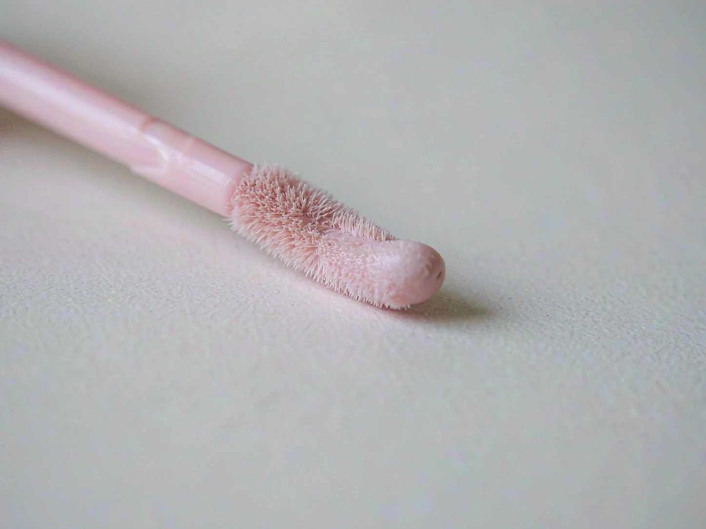 Lip tint applicator with fine flocked soft tip