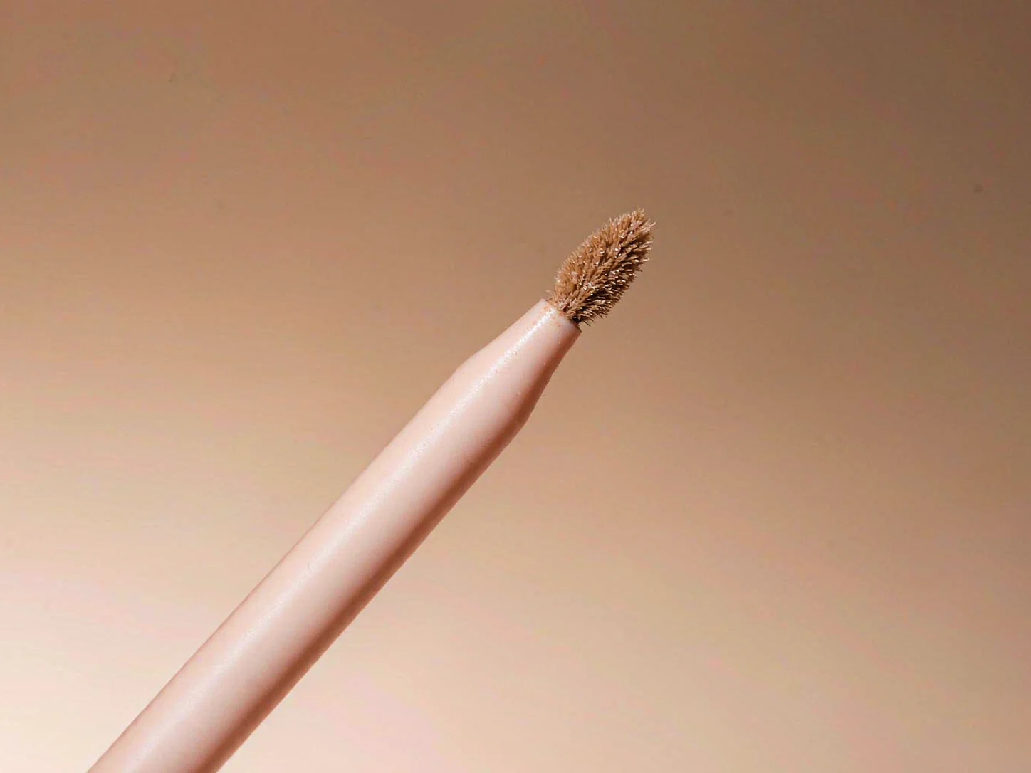 Eye makeup applicator with flocked tip