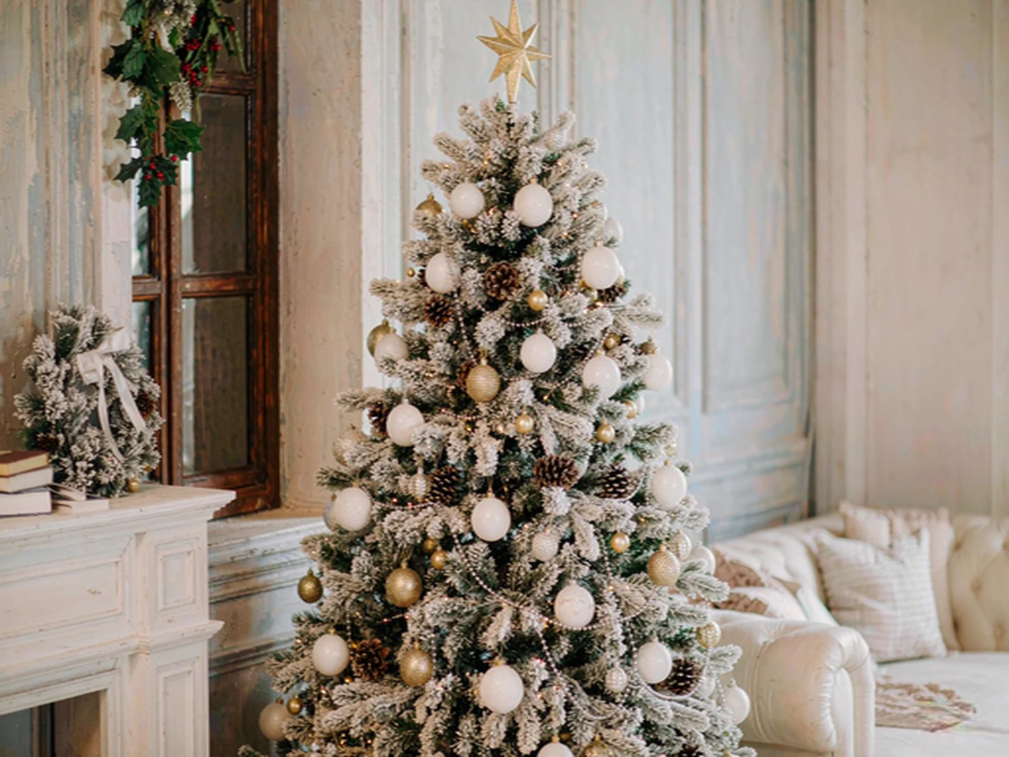 Full-size artificial Christmas tree with snow flocking