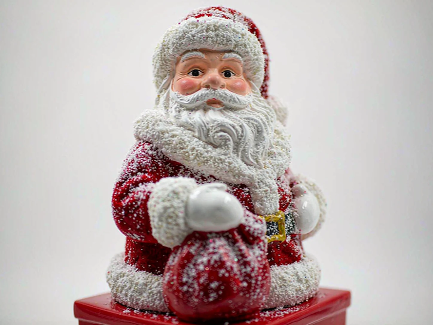 Santa Claus figurine with velvet flocked coat