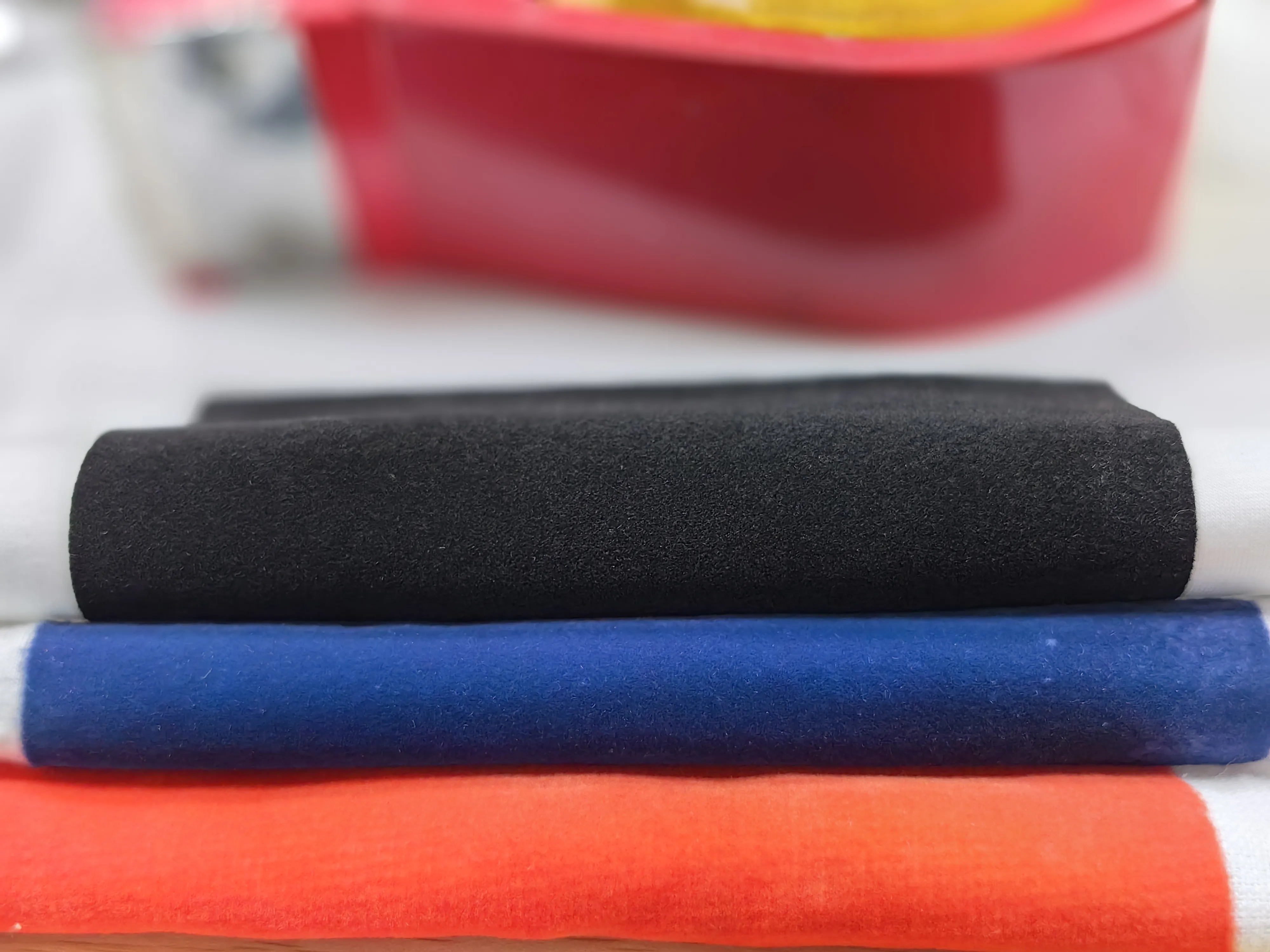 How is Flocking Applied in Textile Manufacturing to Enhance Fabrics?