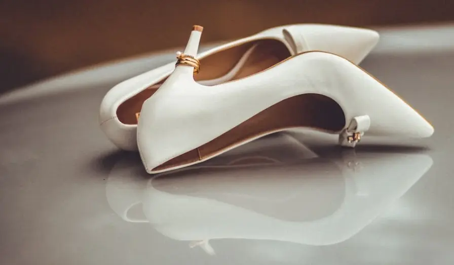 elegant-white-high-heeled-shoes-with-tan-inner-lining,-featuring-durable-nylon-flock-fibers-and-flock-material-for-enhanced-shoe-comfort-and-style.
