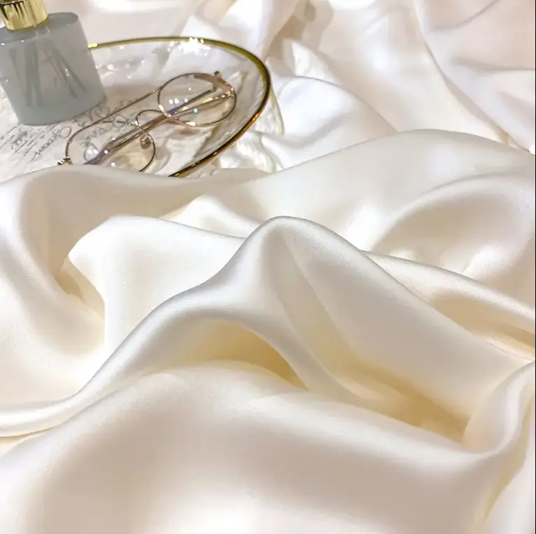 luxury-white-silk-fabric-with-polyester-powder-coating-,-showcasing-high-end-flocking-material-applications-in-packaging-and-accessories