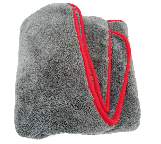 red-gloves-holding-a-snow-covered-heart-shaped-ornament-on-winter-landscape,-ideal-for-promoting-snow-flocking-powder-in-holiday-decorations-and-seasonal-crafts