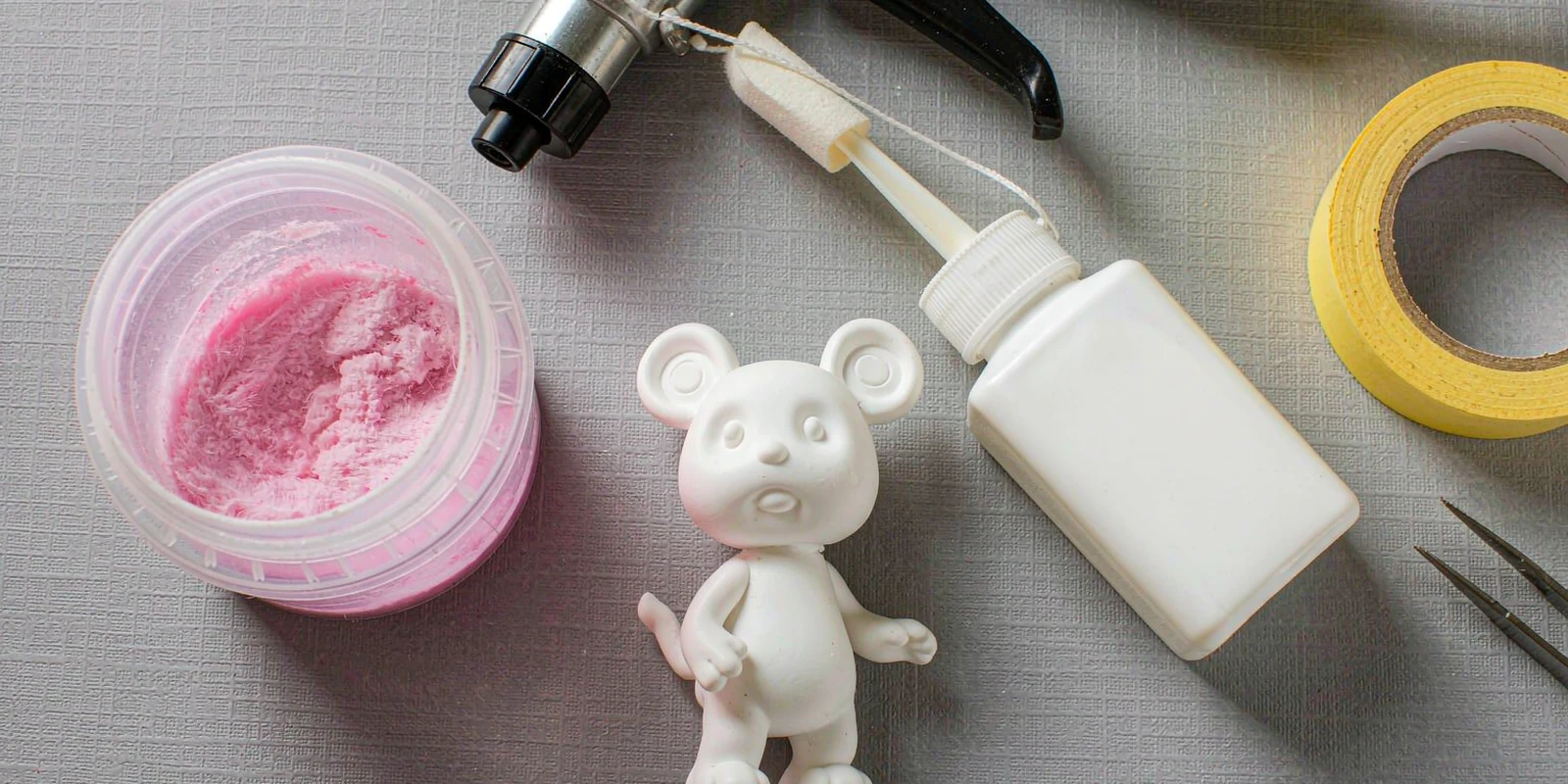Toy flocking workstation with flocking powder, adhesive, electrostatic flocking gun and a blank PVC figurine Toy flocking workstation with flocking powder, adhesive, electrostatic flocking gun and a blank PVC figurine