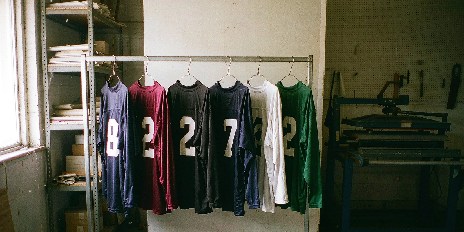 Rack of retro football shirts with flocked numbers in a sportswear print shop Rack of retro football shirts with flocked numbers in a sportswear print shop